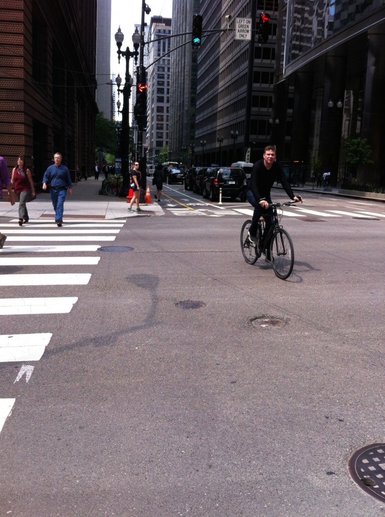 Protected bike lanes provide more safety for Chicago bikers, like the one on Dearborn Street, but most streets do not offer them.